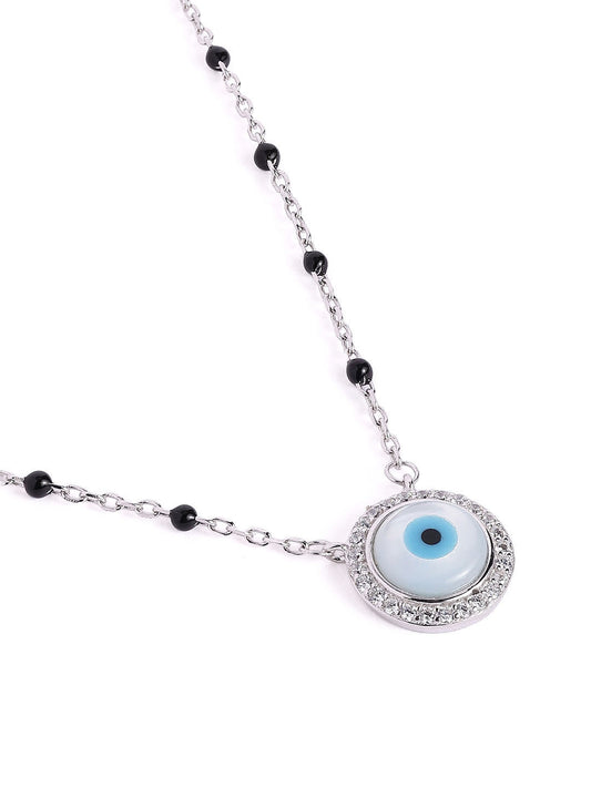 Mangal sutra and earrings set with evil eye-shaped charms on a white background