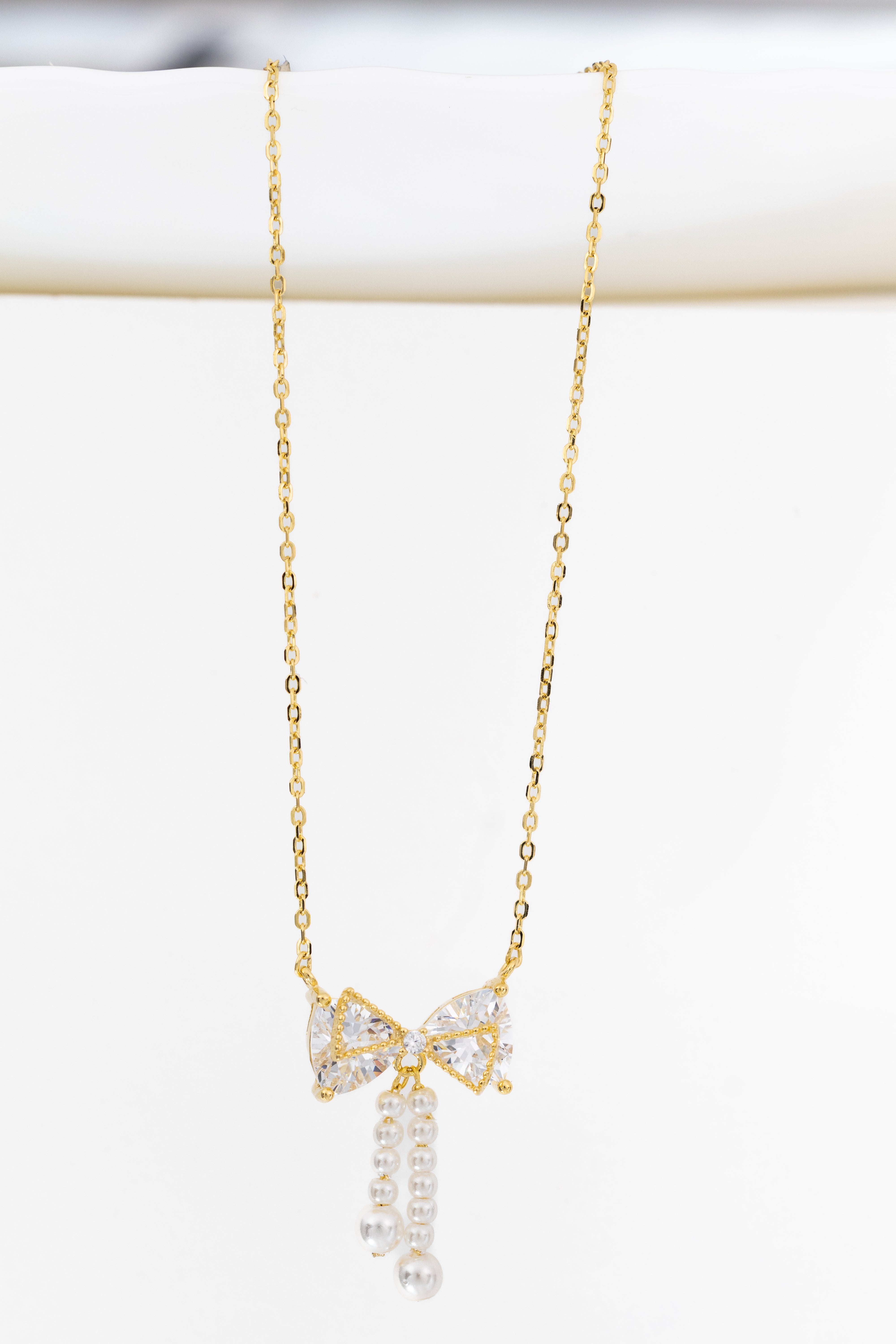 GlamBow Pearl Tassel Necklace