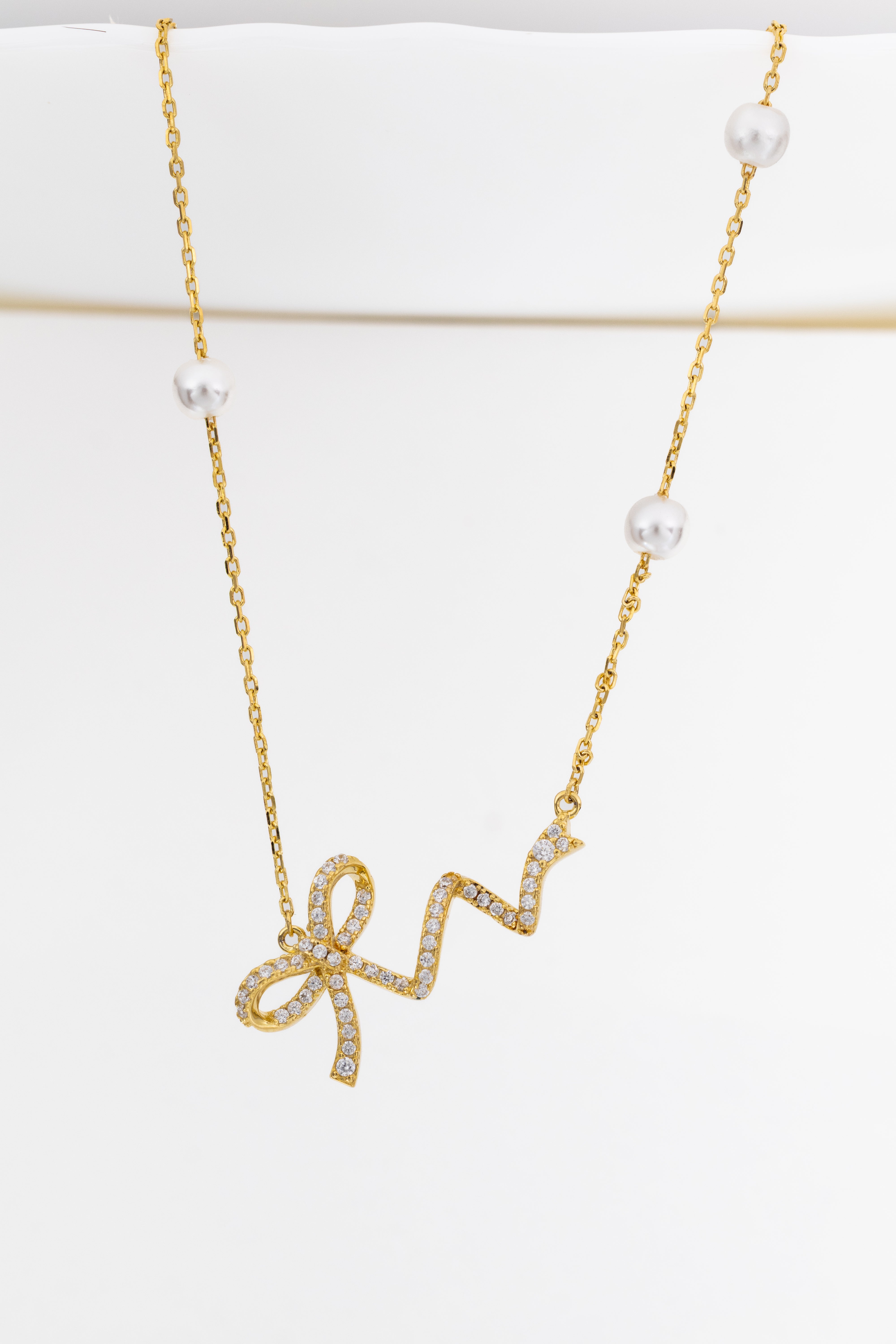 Golden Ribbon Pearl Charm Necklace